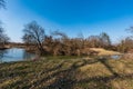 Meandering river with trees around and clear sky during early springtime day - Odra river in CHKO Poodri in Czech republic