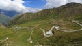 Meandering road climbing up in green mountains Royalty Free Stock Photo