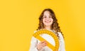 Measure angles in degrees. School lessons. Adorable cute pupil. She loves studying. Small girl holding protractor for Royalty Free Stock Photo