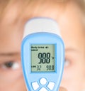 Measure of body temperature by infrared thermometer Royalty Free Stock Photo