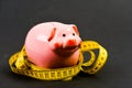 Measure costs. Limited or restricted. Credit loan debt. Piggy bank and measuring tape. Budget limit concept. Economics Royalty Free Stock Photo