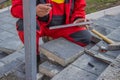 Measure and marking pavement stone before cutting 5