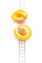 Measure tape and apricot Royalty Free Stock Photo