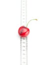 Measure tape and cherry Royalty Free Stock Photo