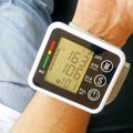 Measure your blood pressure at home using a portable device to check Your health. The device shows a high pressure value Royalty Free Stock Photo