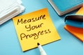 Measure your progress to achieve goals. Memo and marker Royalty Free Stock Photo