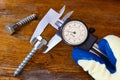 Measurement of the bolt head with a slide caliper Royalty Free Stock Photo