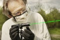 Measuring of bullet trajectory with ballistics trajectory laser and smoke on crime scene