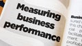 Measuring business performance word printed on a book