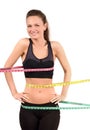 Measuring bust, waist, hips. Beautiful fit girl wrapped with three measuring tapes in inch. Royalty Free Stock Photo