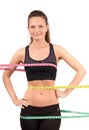 Measuring bust, waist, hips. Beautiful fit girl wrapped with three measuring tapes in inch. Royalty Free Stock Photo