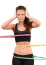 Measuring bust, waist, hips. Beautiful fit girl wrapped with three measuring tapes in inch. Royalty Free Stock Photo