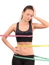 Measuring bust, waist, hips. Beautiful fit girl wrapped with three measuring tapes in inch. Royalty Free Stock Photo