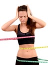 Measuring bust, waist, hips. Unhappy fit girl wrap Royalty Free Stock Photo