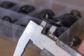 Measuring the diameter of the rubber O-ring with a caliper. Royalty Free Stock Photo