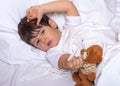 Measuring fever of sick child. Kids flu treatments. Royalty Free Stock Photo