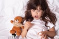 Measuring fever of sick child. Kids flu treatments. Royalty Free Stock Photo