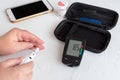 Measuring glucose level blood test with glucometer Royalty Free Stock Photo