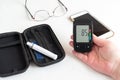 Measuring glucose level blood test with glucometer Royalty Free Stock Photo