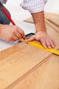 Measuring laminate flooring plancks Royalty Free Stock Photo