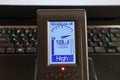 Measuring the level of the electric field near a computer or laptop. EMF meter