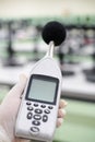 Measuring the noise in laboratory room with a sound level meter.