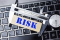 Measuring the risk concept with high precision caliper tool on laptop keyboard