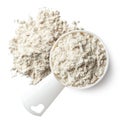 Measuring spoon and heap of vanilla protein powder