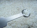 Measuring spoon with rice