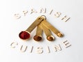 Measuring spoons filled with various spices used in Spanish cooking. Royalty Free Stock Photo