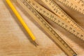 Measuring Stick and Pencil on Wooden Table Royalty Free Stock Photo