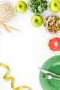 Measuring tape, apples, oat meal and grapefruit for loosing weight on white background top view mockup Royalty Free Stock Photo