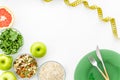 Measuring tape, apples, oat meal and grapefruit for loosing weight on white background top view mockup Royalty Free Stock Photo