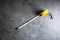 Measuring Tape construction tools on stone pattern background with copy space.Home Repair concept, Repair maintenance concept,