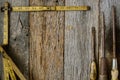 Measuring Tape and Screwdriver on Rustic Old Wood Royalty Free Stock Photo