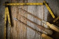 Measuring Tape and Screwdriver on Rustic Old Wood Royalty Free Stock Photo