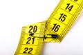 Measuring tape of the tailor for you design. On white background Royalty Free Stock Photo