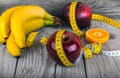 Measuring tape wrapped around a apple weight loss Royalty Free Stock Photo