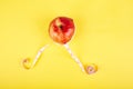 Measuring tape wrapped around a red apple Royalty Free Stock Photo