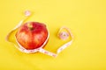 Measuring tape wrapped around a red apple Royalty Free Stock Photo