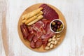 Meat appetizer with olives and nuts on tray Royalty Free Stock Photo