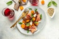 meat appetizer salad for wine prosciutto ham, cherry tomatoes and cream cheese with basil leaves, antipasto. place for Royalty Free Stock Photo