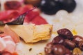 Meat appetizer selection. Salami, prosciutto, bread sticks, baguette, olives and sun-dried tomatoes, selective focus.