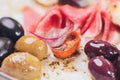 Meat appetizer selection. Salami, prosciutto, bread sticks, baguette, olives and sun-dried tomatoes, selective focus. Royalty Free Stock Photo