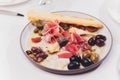 Meat appetizer selection. Salami, prosciutto, bread sticks, baguette, olives and sun-dried tomatoes, selective focus. Royalty Free Stock Photo