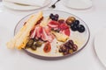 Meat appetizer selection. Salami, prosciutto, bread sticks, baguette, olives and sun-dried tomatoes, selective focus. Royalty Free Stock Photo