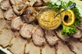 Meat assortment of beef, sausage and ham with greens,meat plate,Sliced boiled ham sausage,Meat with mustard sauce,Cold cuts Royalty Free Stock Photo