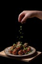 Meat balls with quail egg inside, on a black background Royalty Free Stock Photo