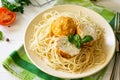 Meat balls turkey with cauliflower in tomato sauce and spaghetti on a wooden table Royalty Free Stock Photo