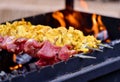 Meat barbeque skewers on fire Royalty Free Stock Photo